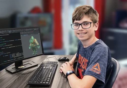 Enfant dans sa chambre participant à un cours de création de jeux vidéo